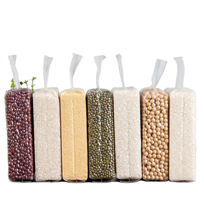 Bolsas de embalaje de plástico de nylon transparente baratas con sellado de enchufe lateral fuerte 1 kg/100 kg Bolsas de embalaje al vacío para alimentos de arroz