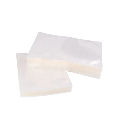 En stock y personalizado transparente transparente de nylon PE laminado plástico de almacenamiento de alimentos de embalaje cámara de vacío bolsas sellador