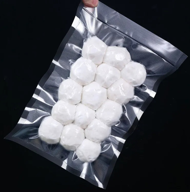 China Proveedor mayorista Bolsa de sello al vacío texturizada en relieve negro transparente embalaje de alimentos bolsas sellador al vacío